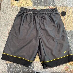 Nike Men's Black Athletic Shorts with Yellow Trim
